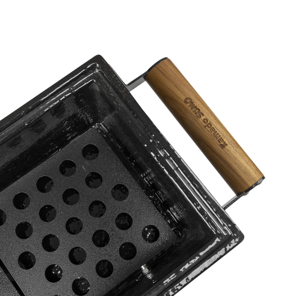 Close-up of Kamado Sumo ceramic grill with wooden handle