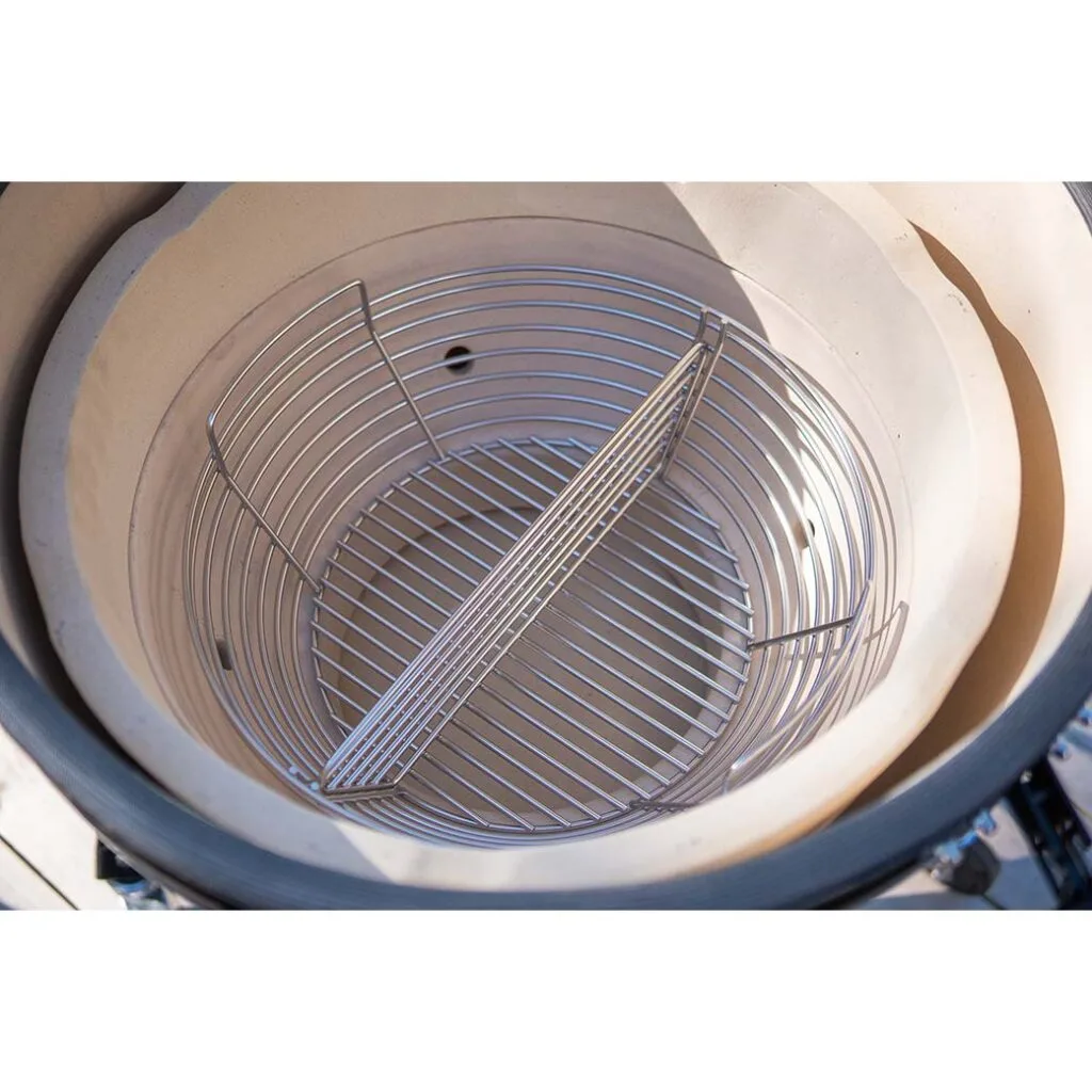 Interior view of a Kamado Sumo ceramic grill with a stainless steel cooking grate